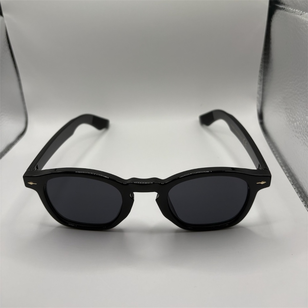 Black round frame sunglasses with dark tinted lenses